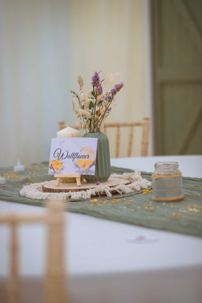 Whimsical Lord of the Rings-themed wedding table with floral centerpieces and elvish details, captured by a South England wedding photographer