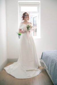 Bride wearing wedding dress, beautiful bridal portrait, wedding day inspiration, stunning bride photography, elegant wedding gown